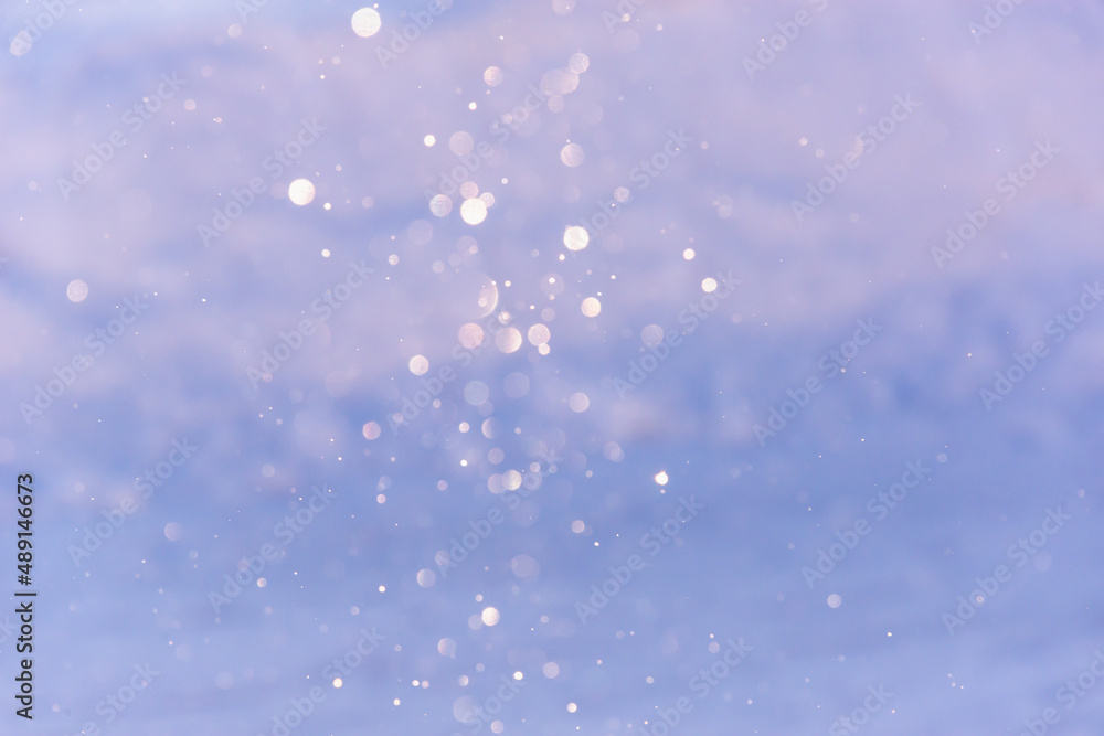Silvery snowflakes falling glow in the sun. Silvery snowflakes falling glow in the sun.