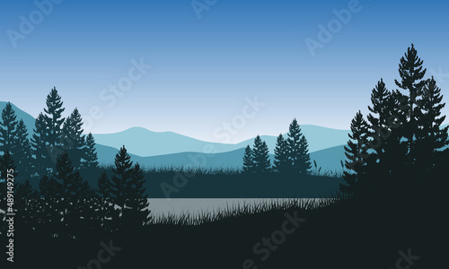 View of mountains and river with an aesthetic silhouette of pine trees from the village in the morning