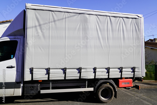 covered truck with grey tarpaulin for mockup gray empty place