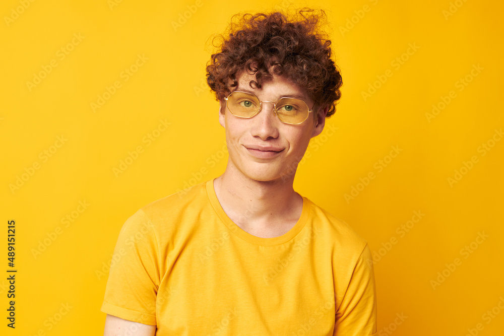 guy with red curly hair Youth style glasses studio casual wear Lifestyle unaltered guy with red curly hair Youth style glasses studio casual wear Lifestyle unaltered