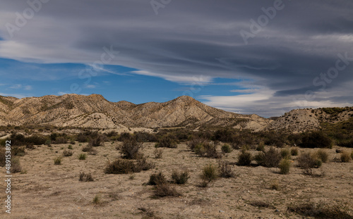 Landscape of Tabernas Desert, Almeria, Spain, against cloudy sky