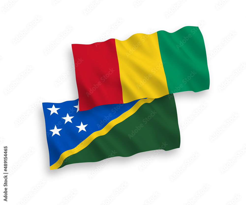 National vector fabric wave flags of Solomon Islands and Guinea isolated on white background. 1 to 2 proportion. National vector fabric wave flags of Solomon Islands and Guinea isolated on white background. 1 to 2 proportion.