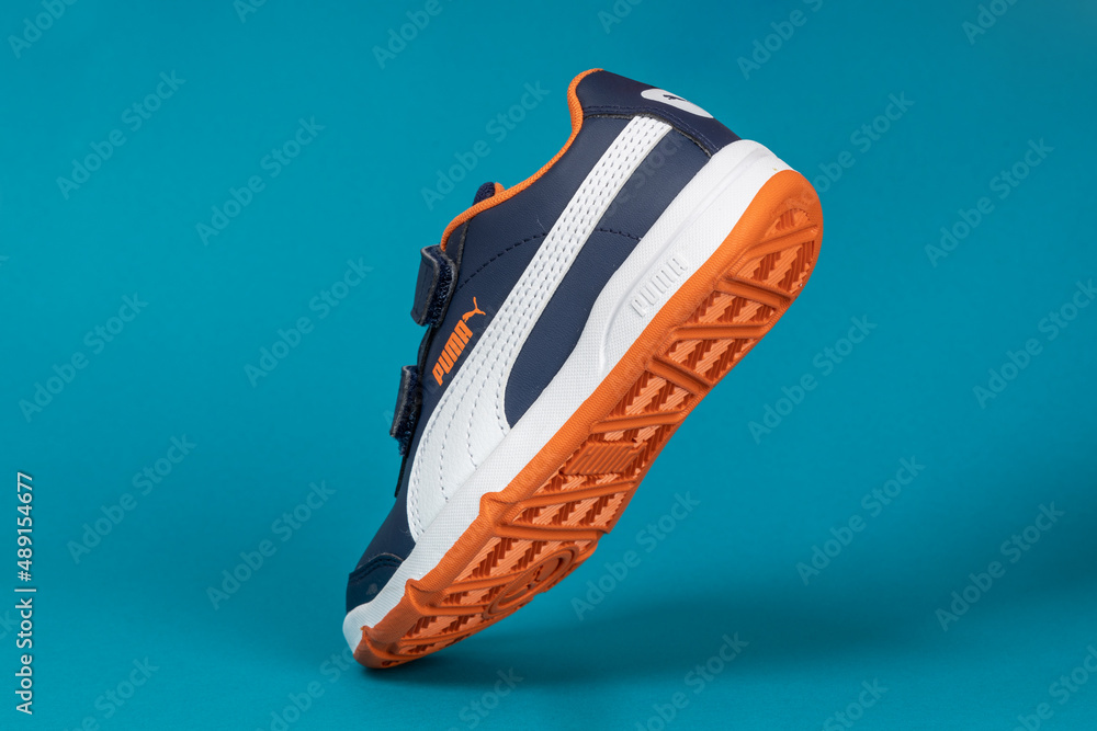 Varna , Bulgaria - MAY 4, 2020 PUMA sport shoe on blue background. Puma is  a German company. PUMA is the third largest sportswear manufacturer in the  world. Product shots Stock Photo | Adobe Stock
