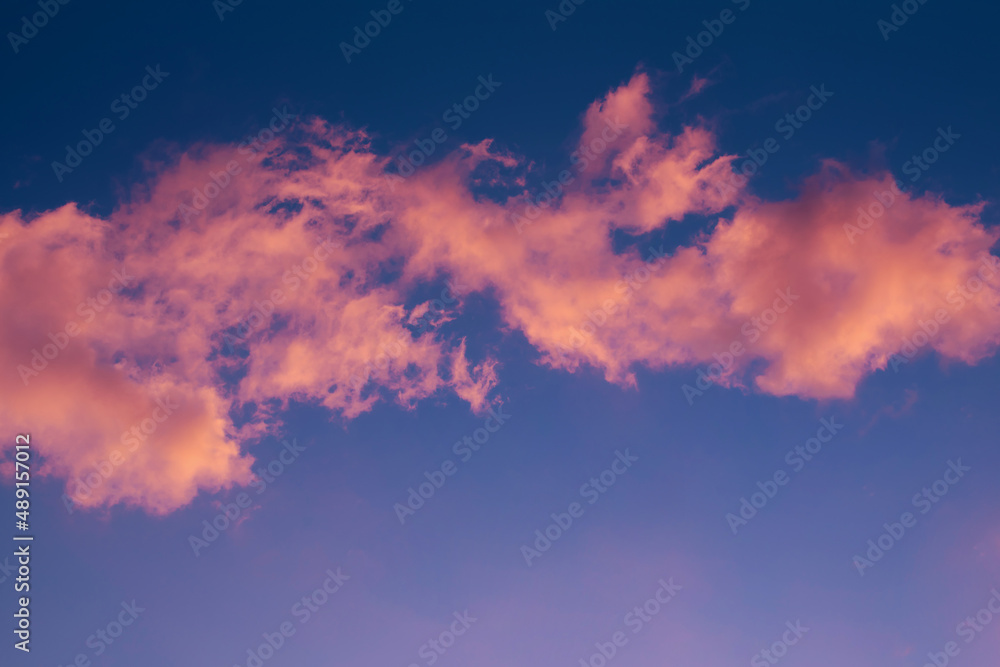 pink clouds on the blue sky background pink clouds on the blue sky background