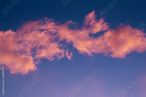 pink clouds on the blue sky background