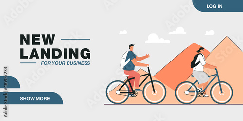 Cartoon tourist couple riding bicycles through desert. Man and woman in front of pyramids in Egypt flat vector illustration. Traveling, tourism, transportation concept for banner or landing web page