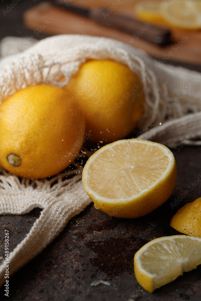 Fresh juicy lemon slices on a dark background