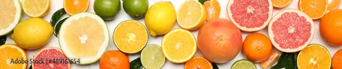Obraz  z motywem Different citrus fruits on white background, top view