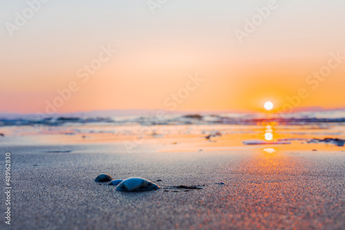 Fototapeta Naklejka Na Ścianę i Meble -  Sunrise in Bibione captured at a lighthouse in Italy. Bibione is a seaside resort in Italy in the region of Veneto, in the province of Venice