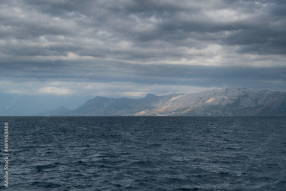 Mountain coast and Adriatic Sea in Croatia during a cloudy day