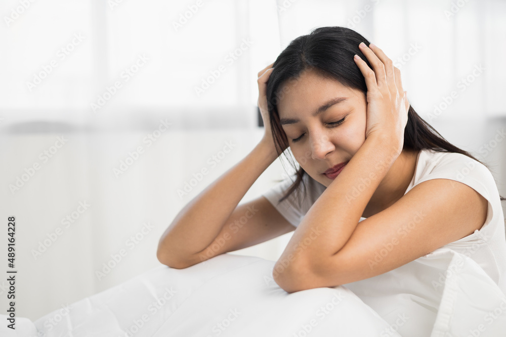 Waking up with a headache. Beautiful woman can't fall asleep moving restless on bed. Young woman having bad dream sleep troubles trying can not sleep. Waking up with a headache. Beautiful woman can't fall asleep moving restless on bed. Young woman having bad dream sleep troubles trying can not sleep.