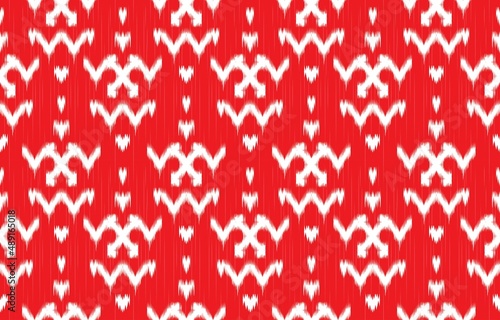 paBeautiful ikat ethnic pattern. The seamless red pattern in tribal, folk embroidery, and Mexican style. Aztec geometric art ornament print. Design for carpet, wallpaper, clothing, wrapping, fabric. photo