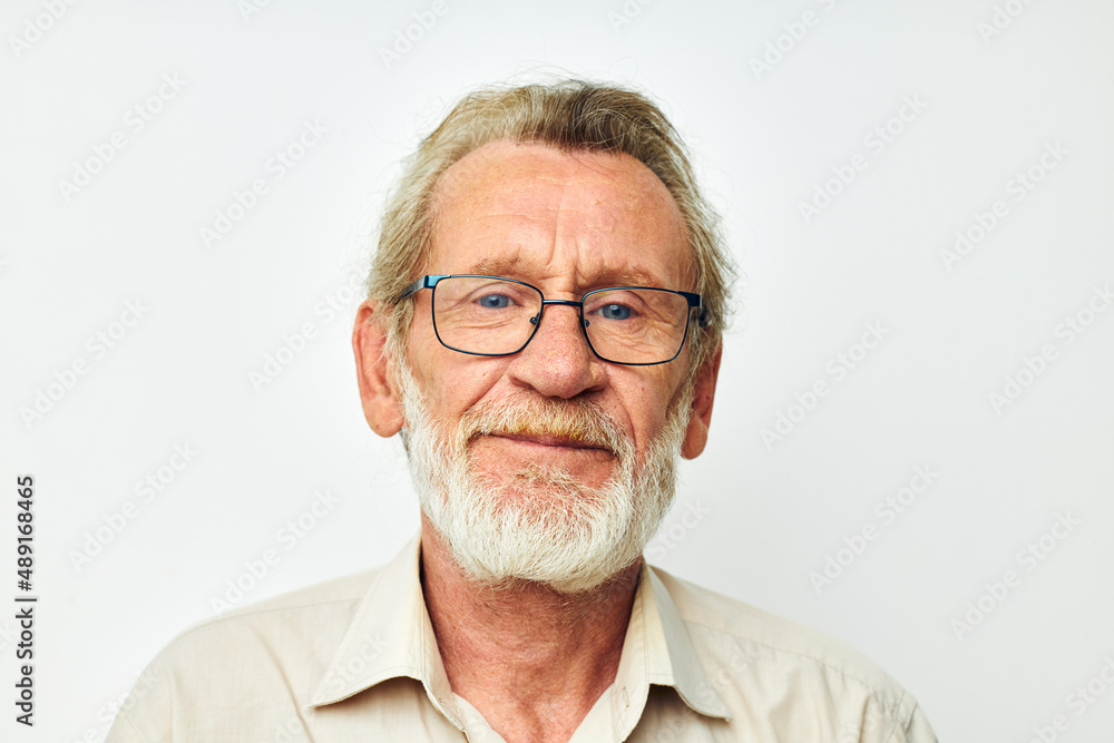 elderly man with a gray beard in a shirt and glasses light background elderly man with a gray beard in a shirt and glasses light background