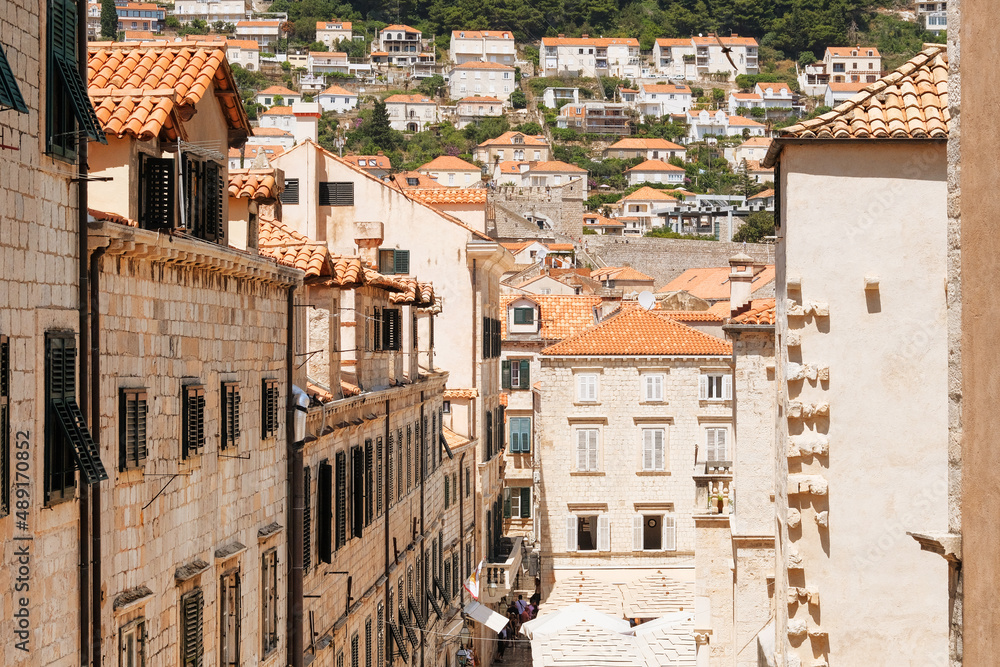 Passage between walls to the old town, the historical part of the city. Rooftop view. Summer in Croatia, Dubrovnik.