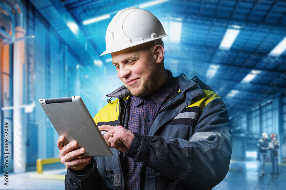 Portrait of a male engineer looking at a tablet Portrait of a male engineer looking at a tablet