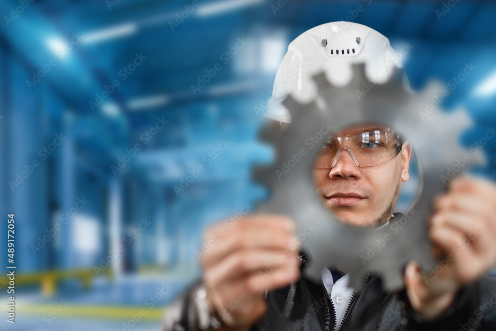 factory engineer checks the quality of the manufactured part factory engineer checks the quality of the manufactured part