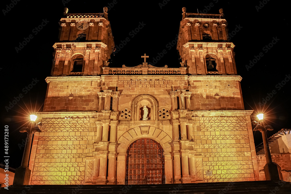 Historic Cathedral of the immaculate conception a illuminated at night, front view, Barichara, Colombia
