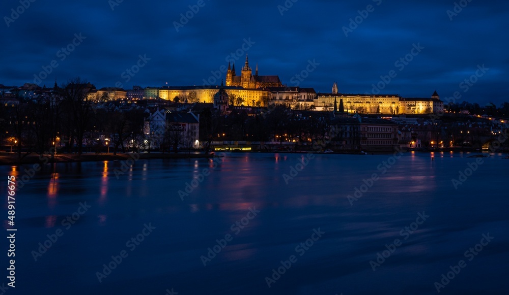 Famous Castle of Prague, Czech Republic, situated over the Vltava river after sunset with beautifully painted sky on the blue hour.