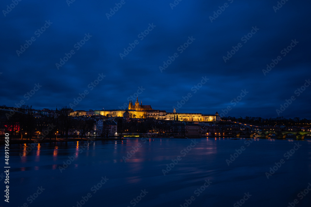 Detail of the famous Castle of Prague, Czech Republic, situated over the Vltava river after sunset with beautifully painted sky on the blue hour.