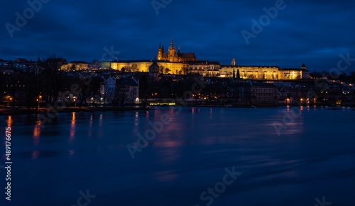 Famous Castle of Prague, Czech Republic, situated over the Vltava river after sunset with beautifully painted sky on the blue hour.