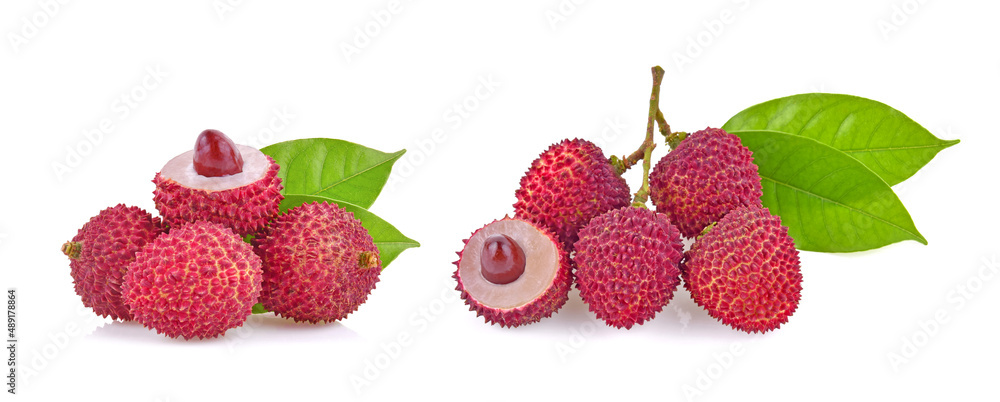 Fresh lychee with leaves isolated on a white background. Fresh lychee with leaves isolated on a white background.