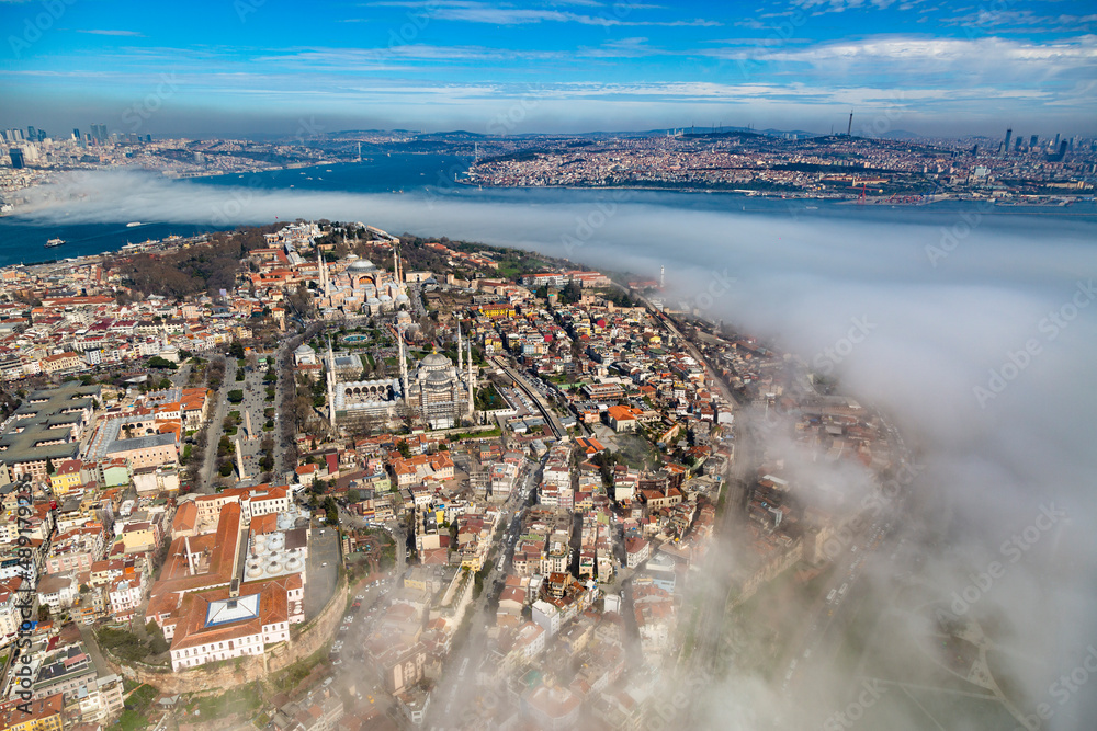 Wide angle aerial view of Istanbul Cityscape in a misty morning - Shot from European side of Istanbul from a Helicopter Sightseeing Tour