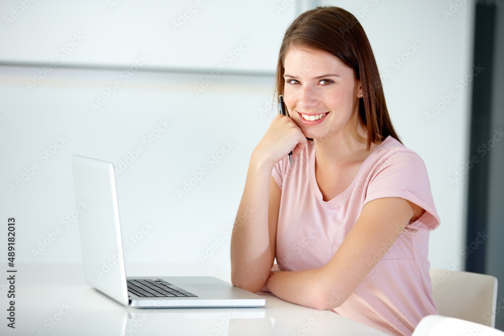 Success is all in a days work. Portrait of a beautiful businesswoman sitting in the office. Success is all in a days work. Portrait of a beautiful businesswoman sitting in the office.