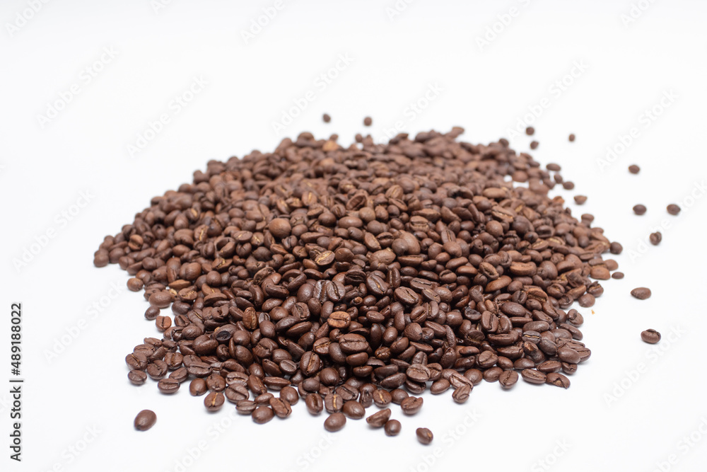 Heap of brown coffee beans on white background Heap of brown coffee beans on white background