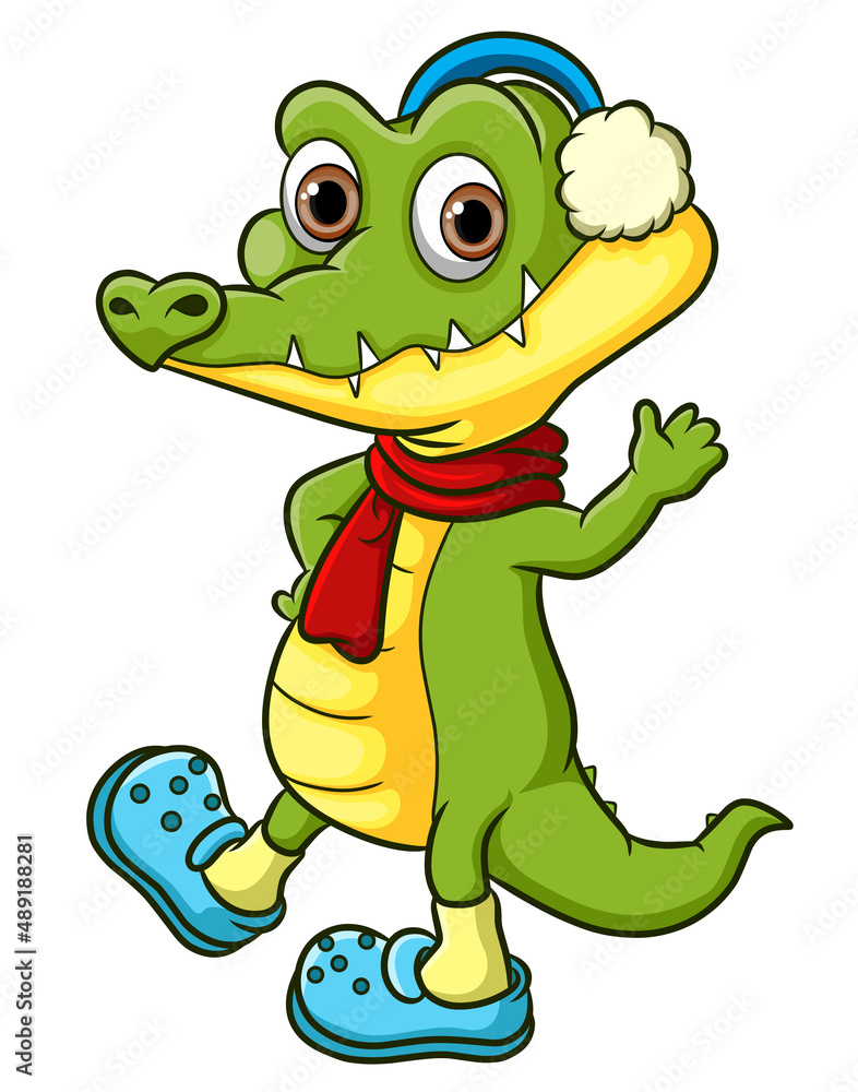 Fototapeta premium The crocodile is greeting and waving hand in the winter