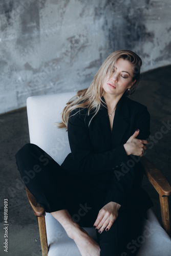 Beautiful girl, blonde, in a black suit, office style, work clothes, no war, Ukraine © Олег Блохин