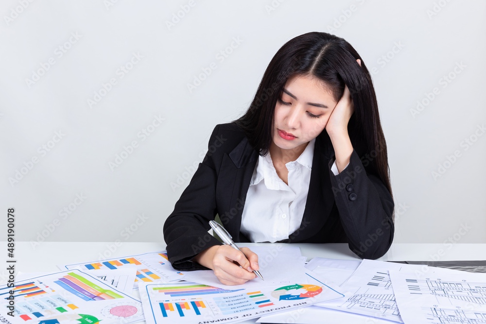 asian business woman working in office with documents. asian business woman working in office with documents.
