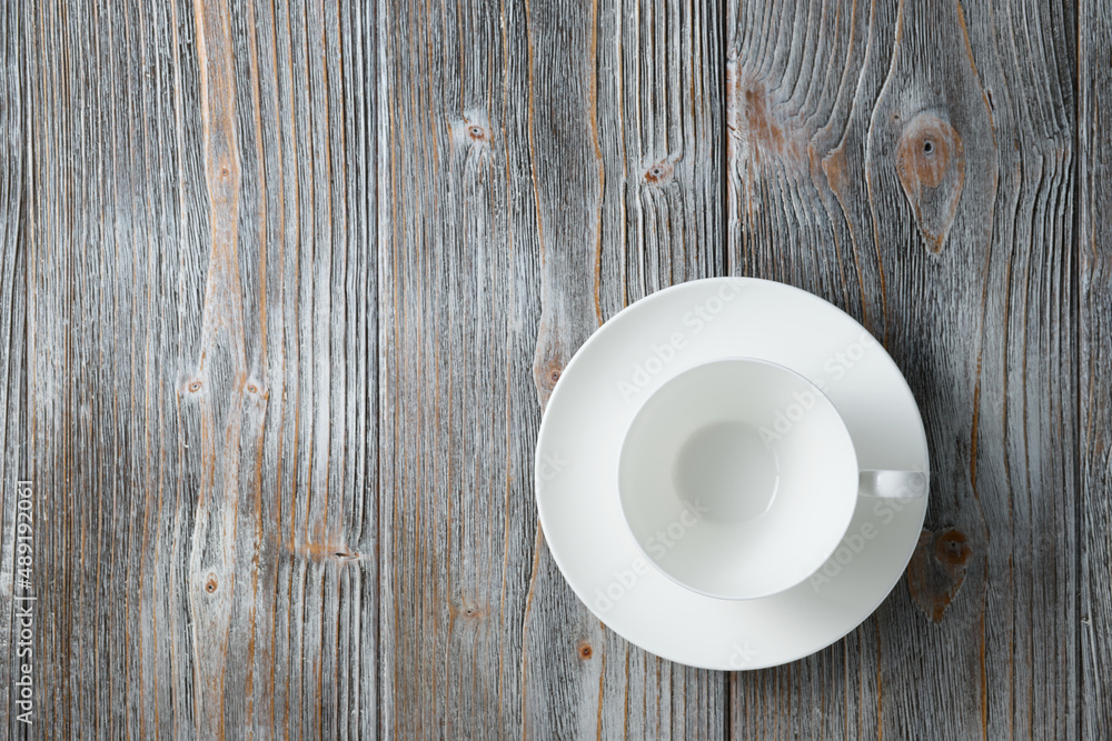 White empty cappuccino cup flat lay wooden background. Empty coffee cup on wooden gray wood background flat lay. White empty cappuccino cup flat lay wooden background. Empty coffee cup on wooden gray wood background flat lay.