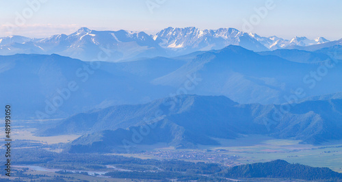 Mountains in blue haze. Morning light  valley and mountainsides.