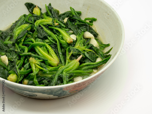 A plate of garlic fried spinach,