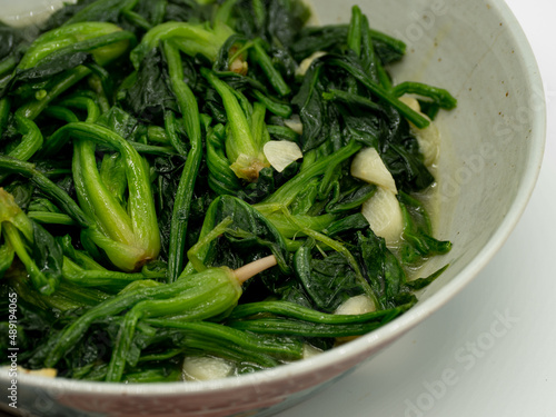 A plate of garlic fried spinach,