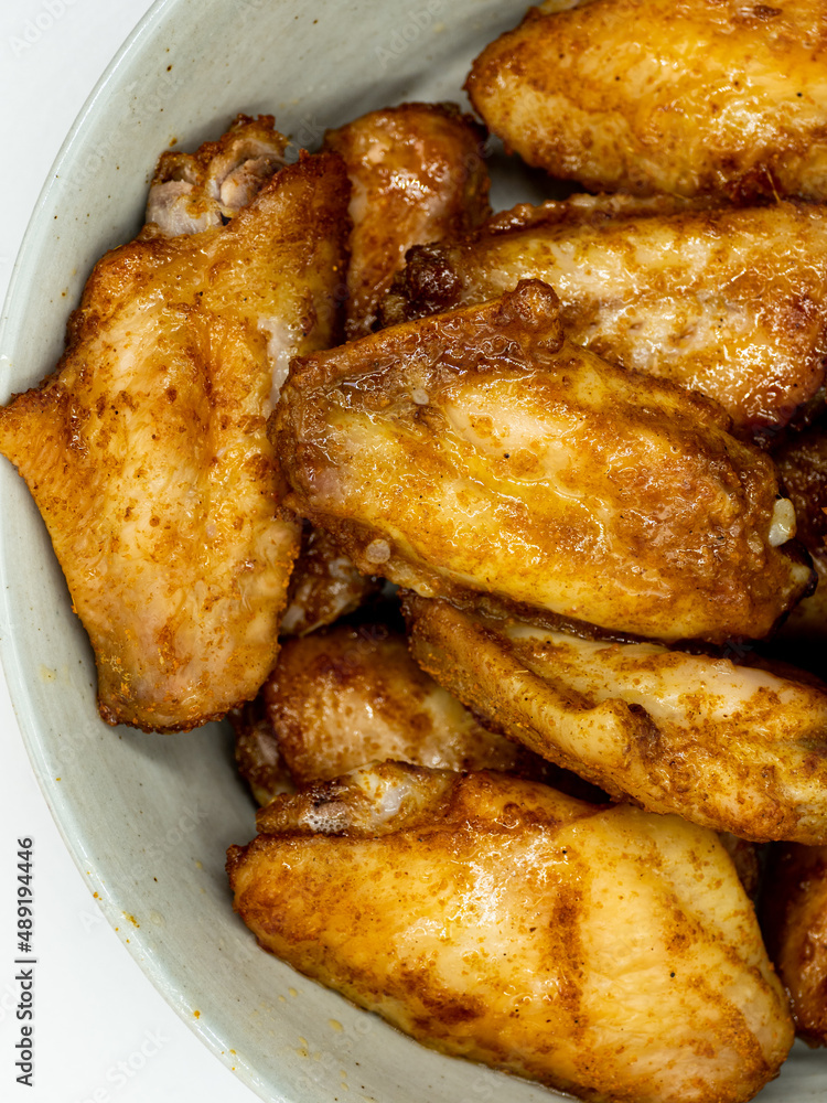 Dinner, a plate of roast chicken wings Dinner, a plate of roast chicken wings
