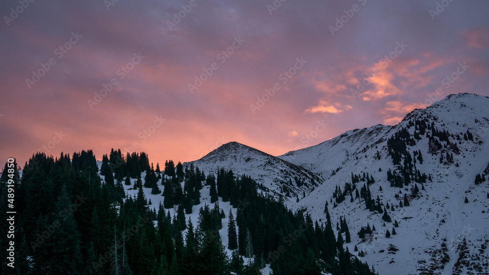 A mountain peak in the light of a pink dawn