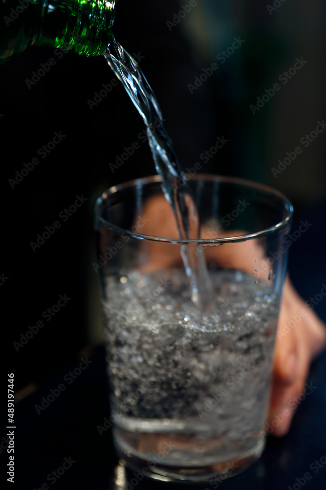 Pouring water in a glass Pouring water in a glass