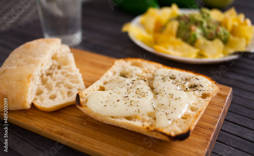 morning toast with melted cheese and provencal herbs