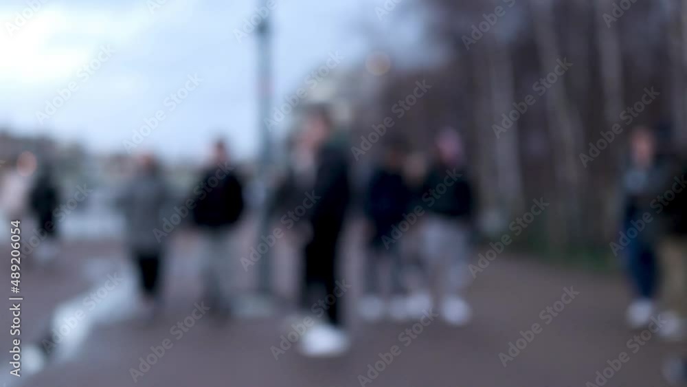 blurred people walking in the street blurred people walking in the street