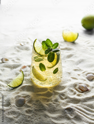 Wallpaper Mural Summer healthy lemonade, cocktails of citrus infused water or mojitos, with lime, ice and mint, diet detox beverages, in glasses on a summer beach. Torontodigital.ca