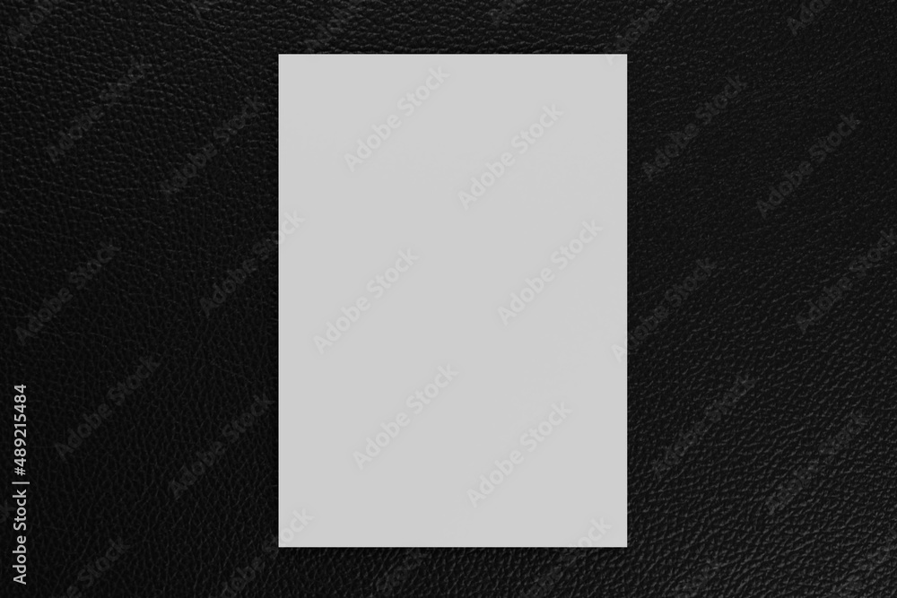 Blank A4 paper template on black leather of background.. Blank A4 paper template on black leather of background..
