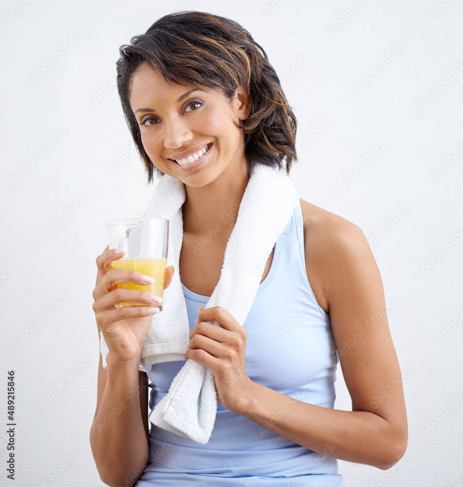 Now thats refreshing. Shot of a beautiful young woman enjoying a glass of fresh orange juice. Now thats refreshing. Shot of a beautiful young woman enjoying a glass of fresh orange juice.