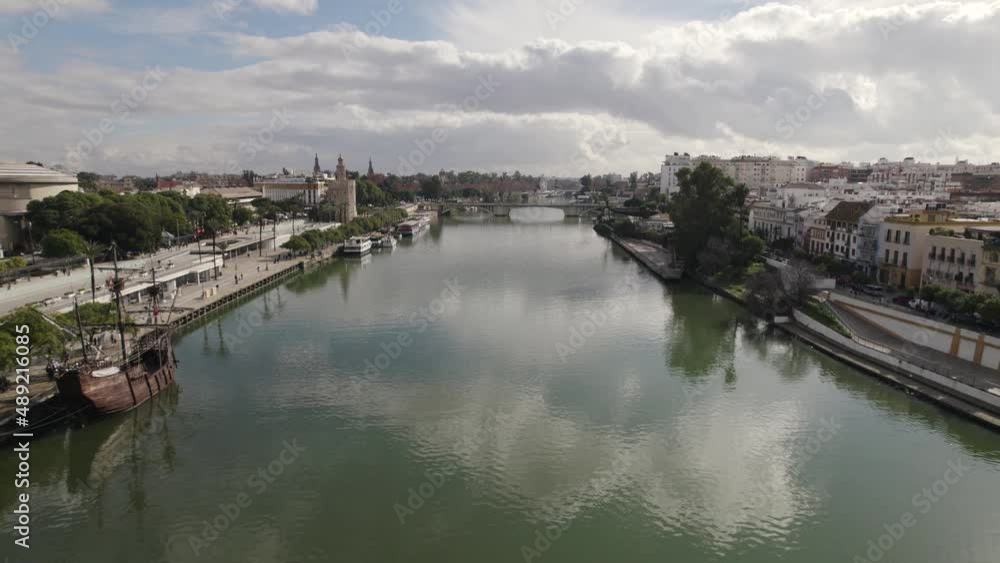 Torre del Oro military watchtower on Guadalquivir river bank; drone push in Torre del Oro military watchtower on Guadalquivir river bank; drone push in