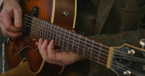 Jazz guitar, Archtop, f soundhole  being played