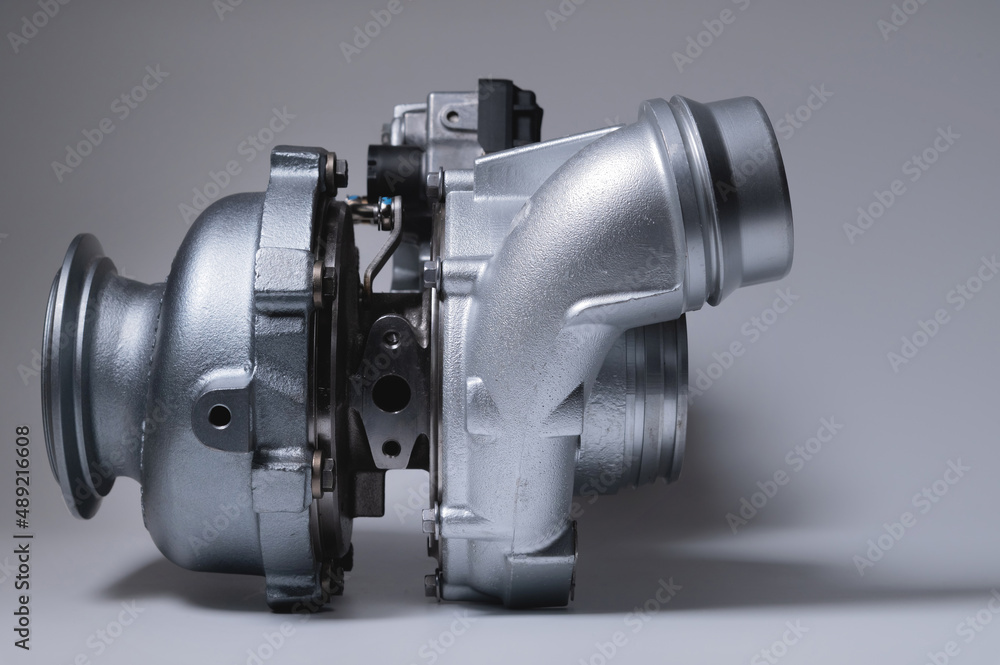 Spare part New car turbine on a white background. close-up. Car parts copy space