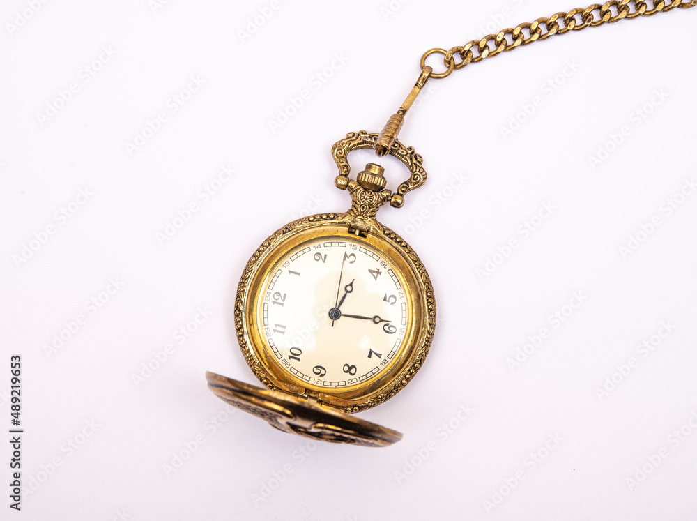 Ancient pocket watch isolated on white with golden chain Ancient pocket watch isolated on white with golden chain
