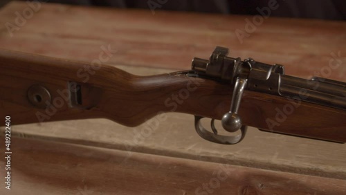 Dolly out from buttstock revealing old Kar98 Mauser rifle photo