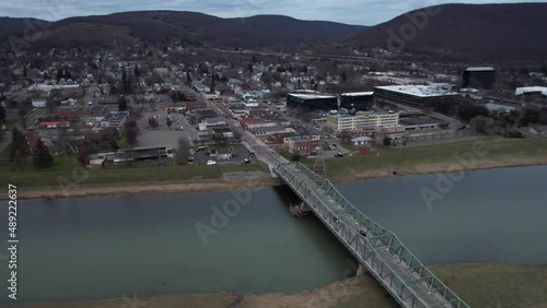 Aerial View of Corning NY State USA, Bridge on Chemung River and Town in Background, Drone Shot photo