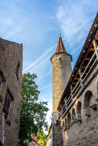 Vertical shot of the Stoeberlein Tower in Rothenburg ob der Tauber, Germany photo